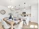 Stylish dining area adjacent to kitchen featuring modern decor, light fixture, and table setting at 1249 Maxwell Ct # 41, Dallas, NC 28034