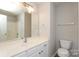 Bathroom featuring a vanity with sink, a toilet, and a shower-tub combo at 14713 Lions Pride Ct, Charlotte, NC 28273