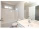 Bathroom featuring a vanity with sink, a toilet, and a shower-tub combo at 14713 Lions Pride Ct, Charlotte, NC 28273