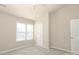 Bright bedroom with plush carpet, ceiling fan and a double window for natural light at 14713 Lions Pride Ct, Charlotte, NC 28273