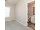 Bedroom with plush carpet and an open doorway into a connecting bathroom at 14713 Lions Pride Ct, Charlotte, NC 28273