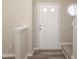 Bright entryway featuring a white front door, hardwood floors and decorative stained glass window at 14713 Lions Pride Ct, Charlotte, NC 28273