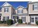 Inviting two-story townhome with neutral siding, dark shutters, and well-maintained landscaping at 14713 Lions Pride Ct, Charlotte, NC 28273