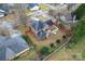 Aerial view of the backyard, screened porch, and red-fenced property at 1511 35Th Ne Ave, Hickory, NC 28601