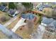 Aerial view of a brick two-story house with a three-car garage and red fence at 1511 35Th Ne Ave, Hickory, NC 28601