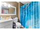 Tidy bathroom with a blue shower curtain and large mirror at 1511 35Th Ne Ave, Hickory, NC 28601