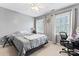 Cozy bedroom with a bed, a desk area, and lots of light from two windows at 1511 35Th Ne Ave, Hickory, NC 28601