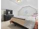 Attic bedroom with a bed, a large dresser, and a window at 1511 35Th Ne Ave, Hickory, NC 28601