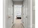 Bright bedroom with access through double doors featuring a large closet and comfortable bed at 1511 35Th Ne Ave, Hickory, NC 28601
