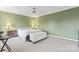 Comfortable bedroom with neutral carpet and lighting at 1511 35Th Ne Ave, Hickory, NC 28601