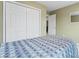 Bedroom with a large closet, neutral-toned walls, and a comfortable bed with patterned bedding at 1511 35Th Ne Ave, Hickory, NC 28601