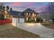 Charming two-story brick home with inviting front yard at dusk at 1511 35Th Ne Ave, Hickory, NC 28601