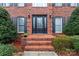 Inviting front entrance with brick steps and a decorative front door with sidelights at 1511 35Th Ne Ave, Hickory, NC 28601