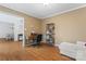 Cozy home office space featuring hardwood floors, a desk setup, and a comfortable loveseat at 1511 35Th Ne Ave, Hickory, NC 28601