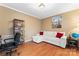 Comfortable home office area with hardwood floors, white loveseat with red pillows, and stylish decor at 1511 35Th Ne Ave, Hickory, NC 28601