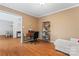 Cozy home office space featuring hardwood floors, a desk setup, and a comfortable loveseat at 1511 35Th Ne Ave, Hickory, NC 28601