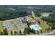 An aerial view of the community, including tennis courts, pool, clubhouse and beautiful landscaping at 19007 Dry Narrows Way, Charlotte, NC 28278