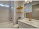 Bright bathroom features a sleek vanity, a tub, and modern fixtures at 19007 Dry Narrows Way, Charlotte, NC 28278
