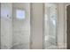 Beautiful bathroom with a luxurious marble tile shower and modern fixtures at 19007 Dry Narrows Way, Charlotte, NC 28278
