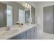 Elegant bathroom with double vanity, quartz countertops, and a stylish framed mirror at 19007 Dry Narrows Way, Charlotte, NC 28278
