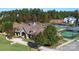 Upscale clubhouse with tennis courts surrounded by lush landscaping and mature trees at 19007 Dry Narrows Way, Charlotte, NC 28278