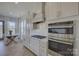 Modern kitchen with stainless steel appliances, oven, and light countertops at 19007 Dry Narrows Way, Charlotte, NC 28278