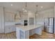 Modern kitchen features stainless steel appliances, an island, and sleek cabinets at 19007 Dry Narrows Way, Charlotte, NC 28278