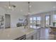 Spacious kitchen with island featuring a stainless steel sink and modern decor at 19007 Dry Narrows Way, Charlotte, NC 28278