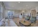 Open floor plan showcases a stylish living area flowing into a well-appointed kitchen at 19007 Dry Narrows Way, Charlotte, NC 28278