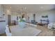 Bright, open-concept living space with light wood flooring and a seamless flow to the kitchen at 19007 Dry Narrows Way, Charlotte, NC 28278