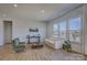 Inviting living room featuring large windows, neutral tones, and ample natural light at 19007 Dry Narrows Way, Charlotte, NC 28278