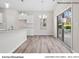 Dining area featuring pendant lighting fixture, breakfast bar, and sliding glass doors with backyard views at 2132 Clapham Ct, Charlotte, NC 28215