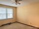 Neutral-toned bedroom features carpet and a ceiling fan at 219 W Edison Dr, Statesville, NC 28625