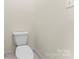 This bathroom has a clean toilet, and white colored walls at 2323 Pinefield Ct, Gastonia, NC 28056