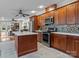 Modern kitchen featuring stainless steel appliances, an island with a marble countertop, and stylish backsplash at 246 Apache Rd, Troutman, NC 28166