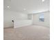 Spacious bonus room featuring a large window for lots of natural light and plush carpeted floor at 2576 Blue Sky Meadows Dr, Monroe, NC 28110