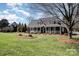 Beautiful brick home featuring a well-maintained lawn and inviting front porch at 286 Canvasback Rd, Mooresville, NC 28117