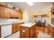 Eat-in kitchen area featuring an island with a granite countertop and views of the dining area at 286 Canvasback Rd, Mooresville, NC 28117