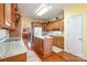 Kitchen area offering wood cabinets, granite countertops, an island and hardwood flooring at 286 Canvasback Rd, Mooresville, NC 28117