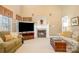 Comfortable living room with a fireplace, plush sofas and a large flatscreen TV at 286 Canvasback Rd, Mooresville, NC 28117