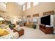 Open concept living area with soaring ceilings, lots of natural light, and comfortable furnishings at 286 Canvasback Rd, Mooresville, NC 28117