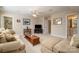 Spacious living room with plush sofa, ottoman, and a large tv for entertaining at 286 Canvasback Rd, Mooresville, NC 28117