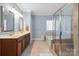 Large bathroom with double vanity, soaking tub, and walk-in shower at 4008 Saint Andrews Ct, Cramerton, NC 28032