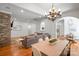 Open-concept living area with hardwood floors, a stone fireplace, formal dining, and seamless flow for entertaining at 4008 Saint Andrews Ct, Cramerton, NC 28032