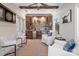 Entertaining space featuring a bar with custom cabinetry, mini-fridge, stone backsplash, and comfortable seating at 4008 Saint Andrews Ct, Cramerton, NC 28032