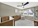 Bedroom with a soft gray carpet and modern ceiling fan at 4106 Castlewood Rd, Charlotte, NC 28209