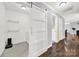 Bright laundry area with a sliding barn door and gray tile floors at 4106 Castlewood Rd, Charlotte, NC 28209