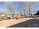 Spacious backyard view featuring a picnic table with waterfront community in the background at 431 Island Cove Rd # 86, Norwood, NC 28128