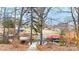 View of backyard sloping down towards lake with boat docks and waterfront neighborhood at 431 Island Cove Rd # 86, Norwood, NC 28128