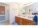 Bathroom showcasing a vanity with double sinks and traditional cabinetry at 431 Island Cove Rd # 86, Norwood, NC 28128